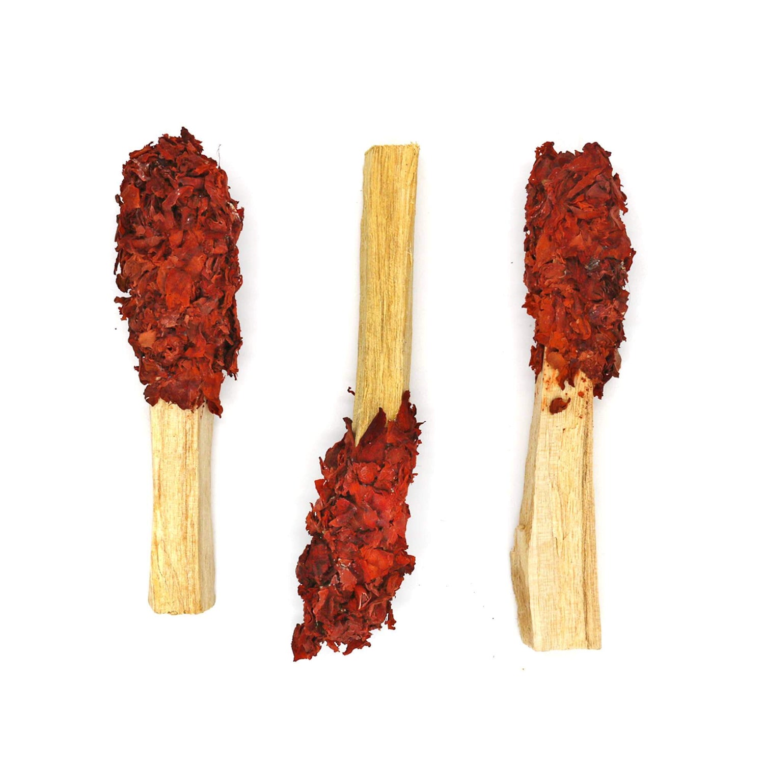 Three Palo Santo Pops smudge sticks with red herb layers for aromatic and therapeutic benefits.